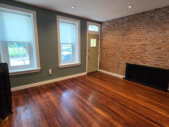 Living room with exposed brick.