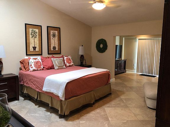 Large en-suite master with tv in bedroom. Attached master retreat with access to the pool.