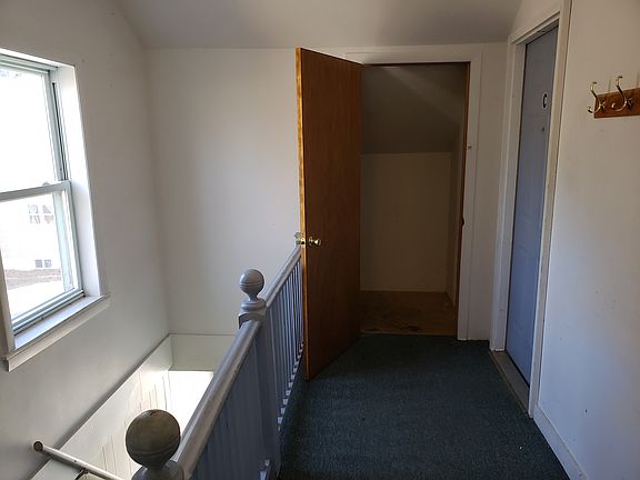 Common Interior stairwell to Apt C showing storage closet included in rent.