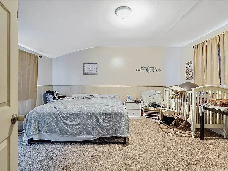 This is an example of how the master bedroom can be set up for comfort. This is a great big room with light and windows on both sides. Walk in closet and private entrance adjacent make this room super convenient for a quiet retreat.