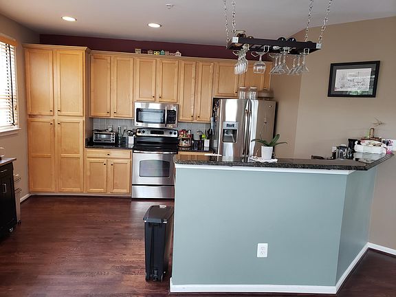 Kitchen with granite counters, stainless steel appliances (included)