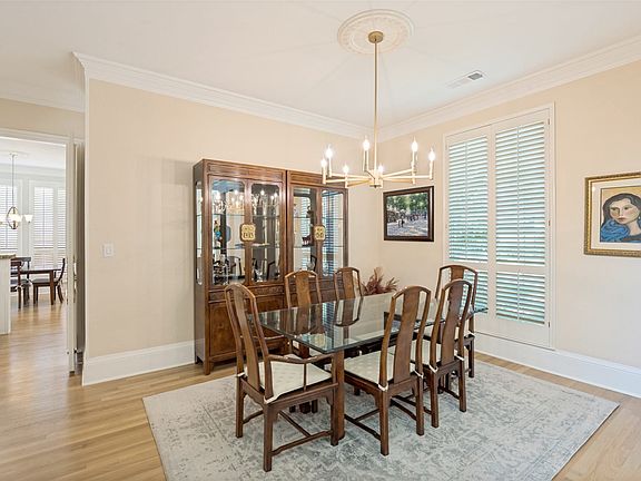 Formal dining room and through the opening to the left you get a glimpse of the wet bar and breakfast area.