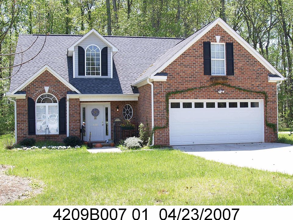 Photo 2007/yard & non-invasive trailing plant around garage more established.