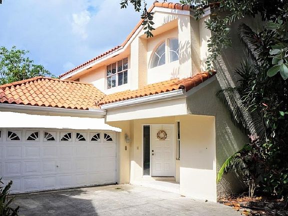 House entrance and two-car garage