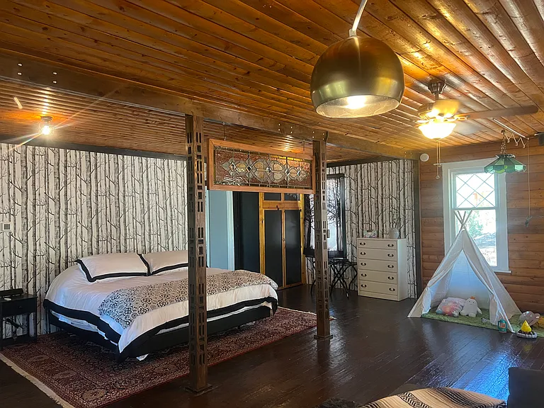 Closet and 6 drawers for clothing storage. Ironing Board, Floor Fan, two yoga mats or T-Pees for 2 children. Glow-in-the-dark sleeping bags and toy camp supplies.