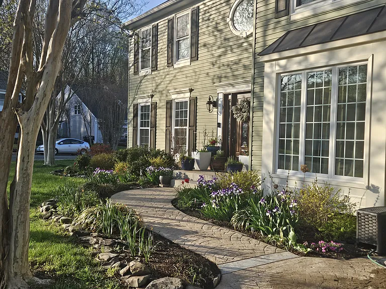 Entry way into the home from the driveway, this is in March