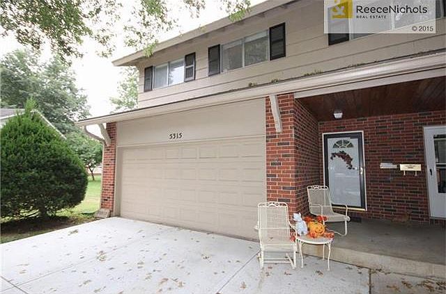 Front of Town Home.  Note Covered Front Porch, 2 Car Garage, & New Driveway.