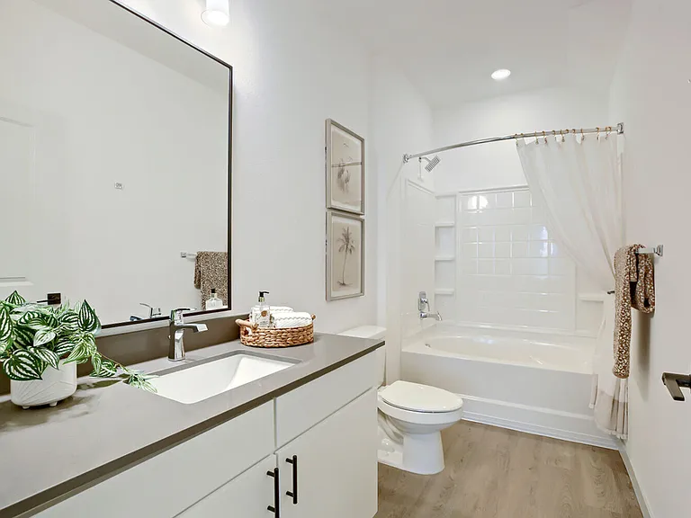Unwind in a full soaking tub after a long day _ bathrooms at Garrett Harvest Junction West are designed for comfort and style. Longmont, CO.