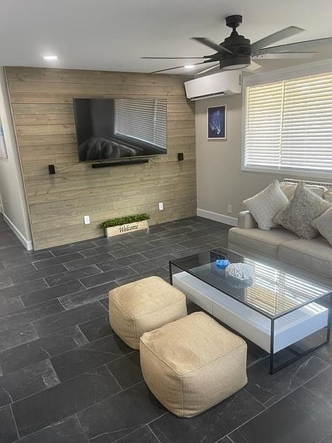 Living room area. With ac unit.
