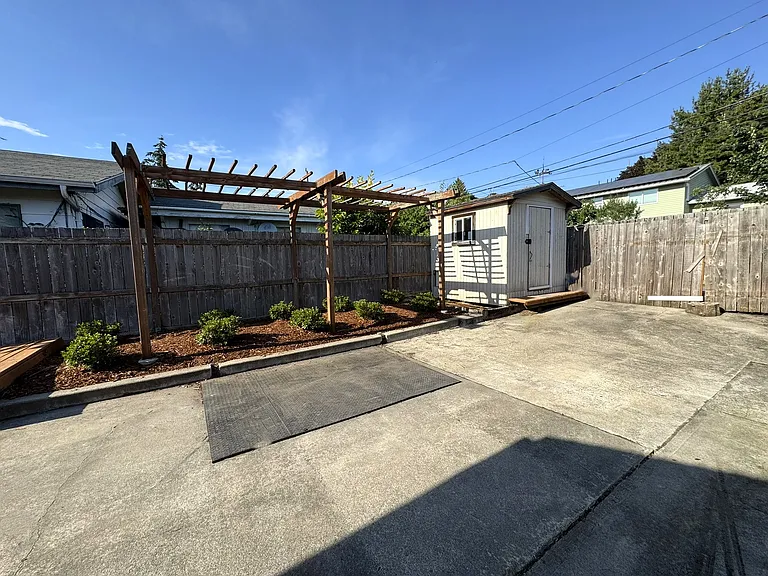 Parking area, garden & storage shed