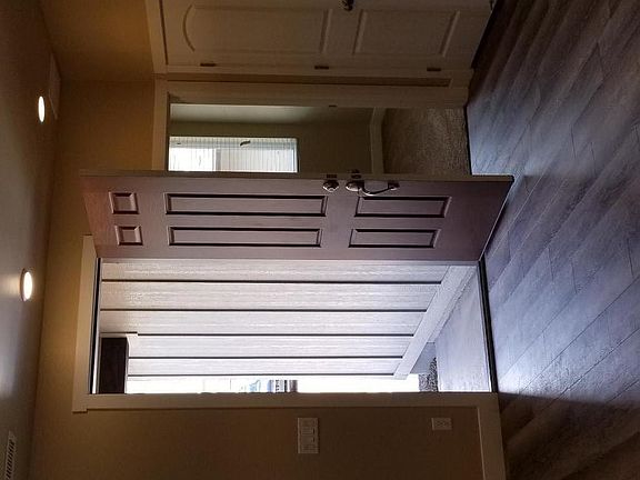 Entry into great room with laminate easy care plank floorinf in all spaces except bedrooms