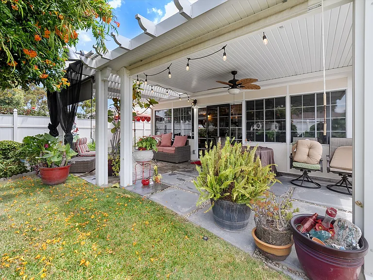 covered seating area and sunroom windows