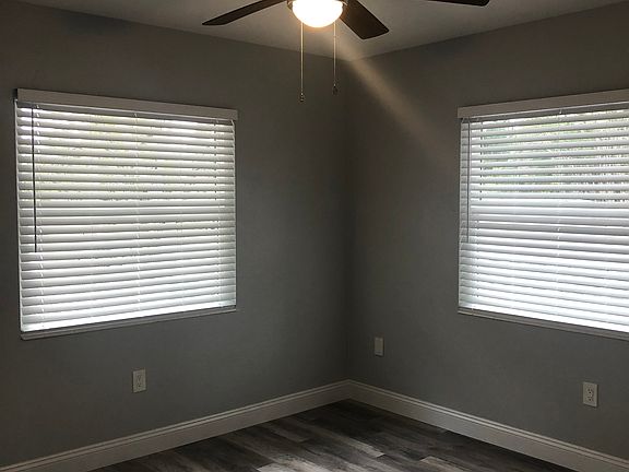 Spacious bedroom with two large windows