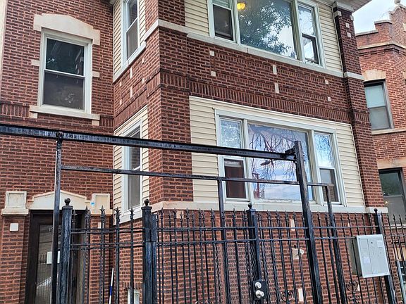 Classic and jumbo all-brick two-flat in bustling Humboldt Park.