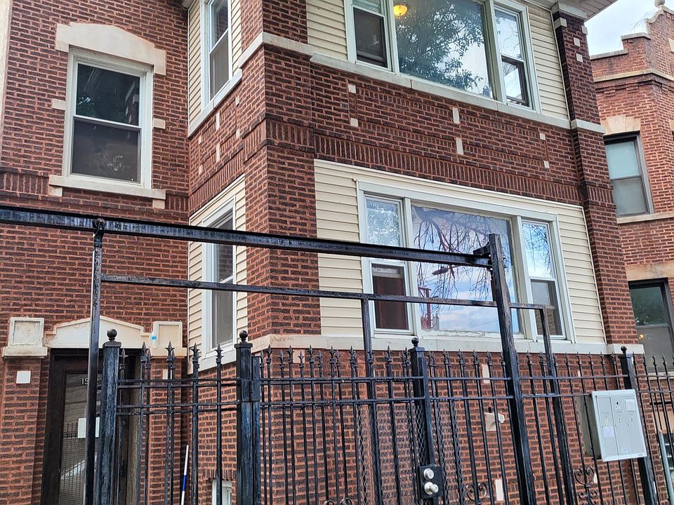 Classic and jumbo all-brick two-flat in bustling Humboldt Park.
