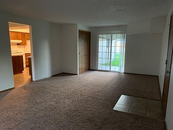 Family room view into kitchen and view of sliding door to the back yard.