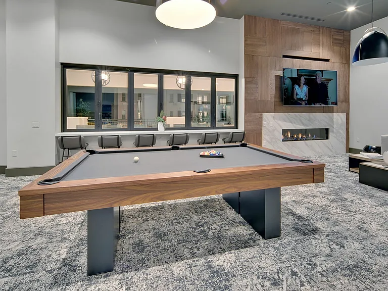 Game room with pool table at Enclave Heritage Flats in Otay Ranch