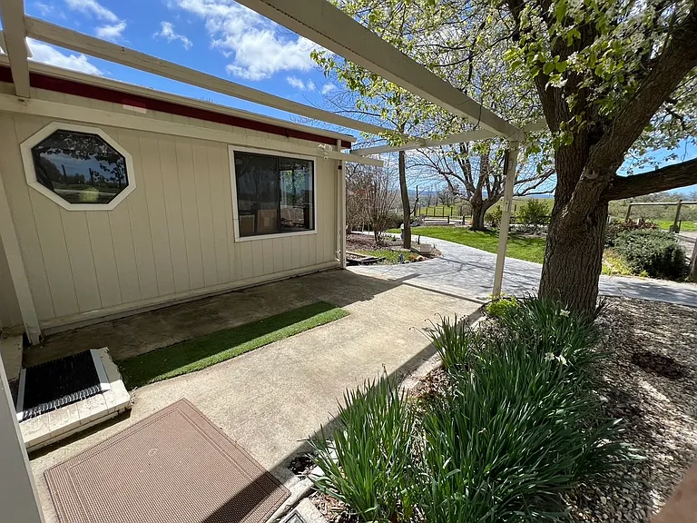 Springtime photo of entryway and front yard