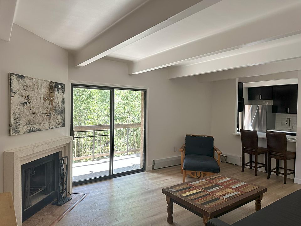 Living room, fireplace and private deck