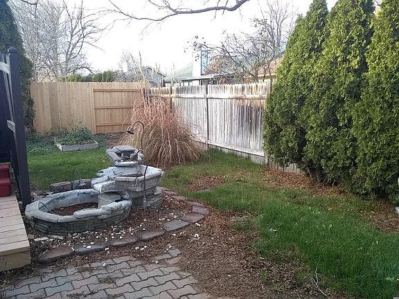 Partial view of backyard with water fountain