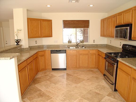 Completely remodled kitchen with stainless, stone floors and granite tops