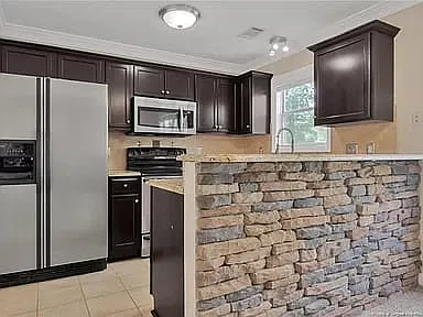 Bar height countertop with brick fascade