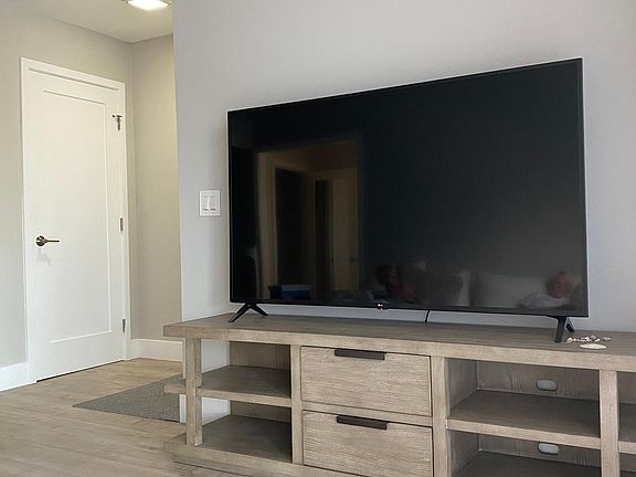 Flat screen Apple TV with built in Netflix, Hulu, YouTube, etc