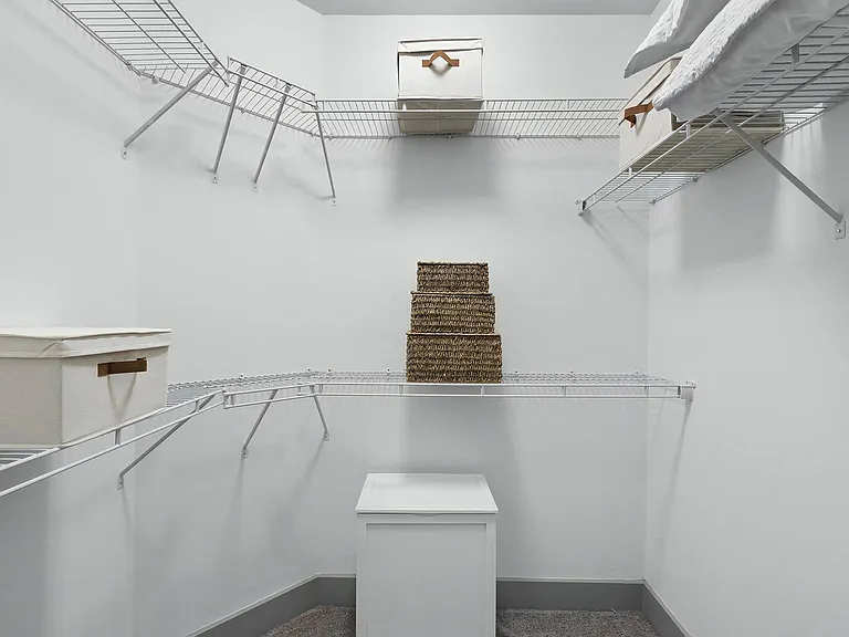 Spacious Walk-In Closet with Wire Shelving and Ample Storage