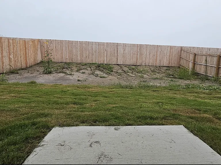 Fenced Backyard- entire yard will be filled in with sod by Move-In