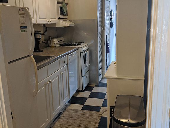 Beautiful kitchen with microwave, disposal, refrigerator, gas stove