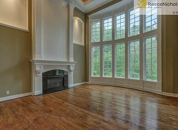Astounding Great Room w/ Fireplace and Dramatic 2 story windows