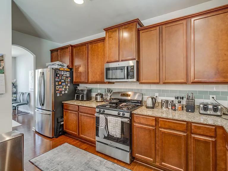 Spacious kitchen with granite counter tops
