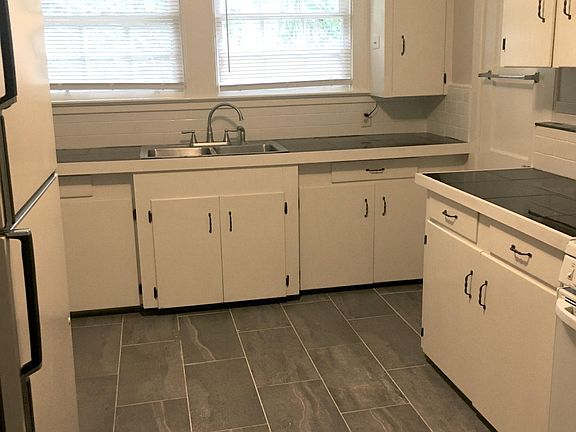 Updated kitchen with brand new ceramic tile on floor. Updated countertops and paint a few years ago.