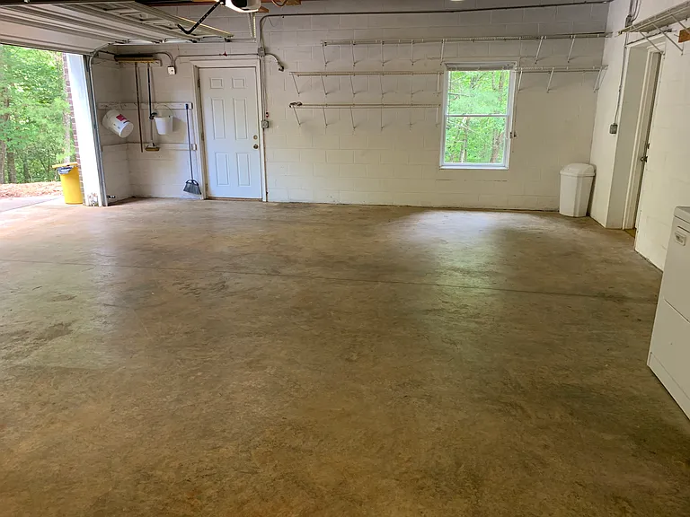 Large attached garage that is open and airy with natural light
