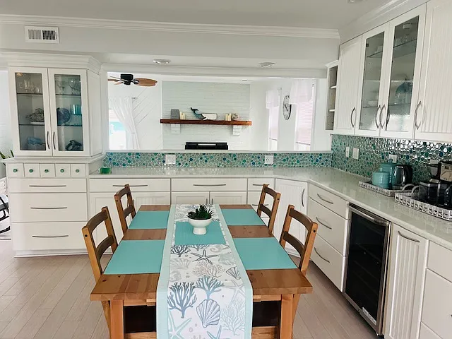 Dining table extends at each end to seat 6. Extra chairs kept in foyer closet for easy access