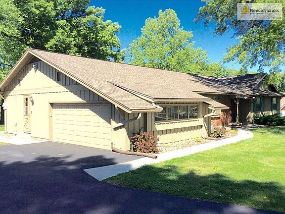 Two car garage, blacktop driveway redone two years ago and concrete sidewalk done at same time.