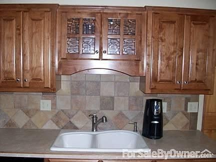 Kitchen : Delta Faucets and Kohler sinks throughout the home.