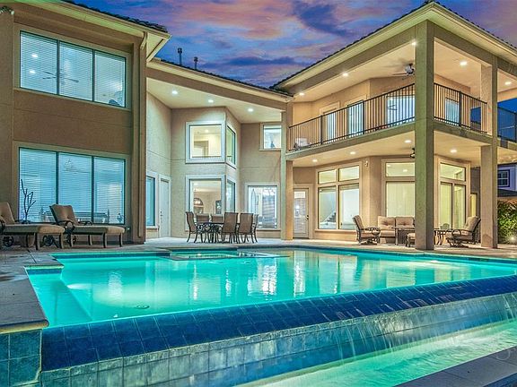 Beautifully designed infinity pool and spa with magnificent views of the lake