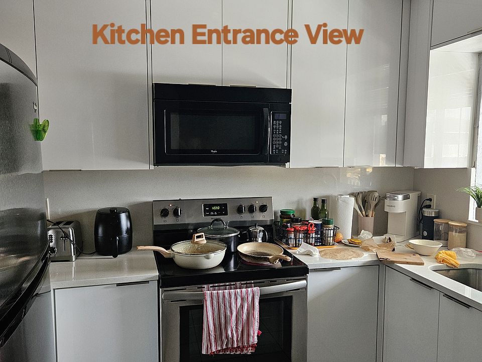 Kitchen Entrance View
Stainless Steel Range. Built in Microwave Oven