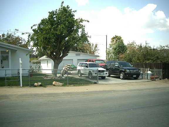 BOTH DETATCHED GARAGES ON THE RIGHT 