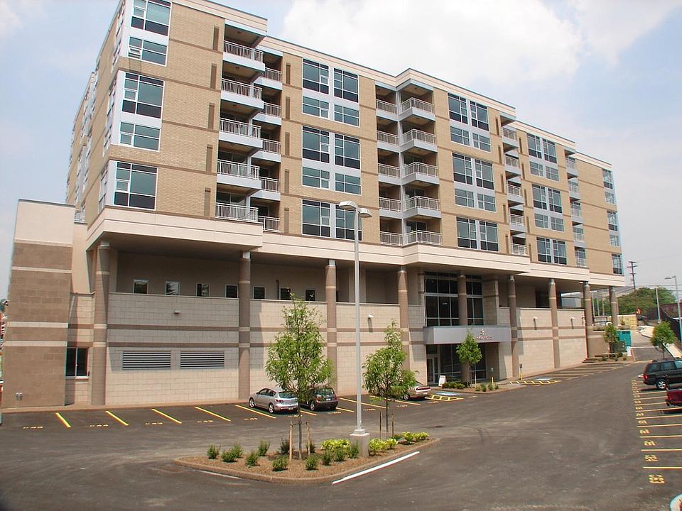 Condo building and reserved parking spaces in front of building entrance
