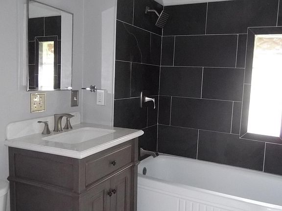 Bathroom, tub and shower.