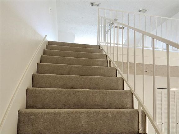 Stairs leading to study loft.