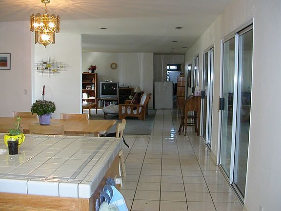 Most rooms have one wall of glass (sliding doors) to the covered patio.