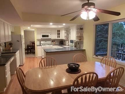 Oversized kitchen with tons of cabinets, desk area and large pantry.
