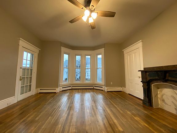 Spacious living room off of kitchen with access to screened-in-porch.