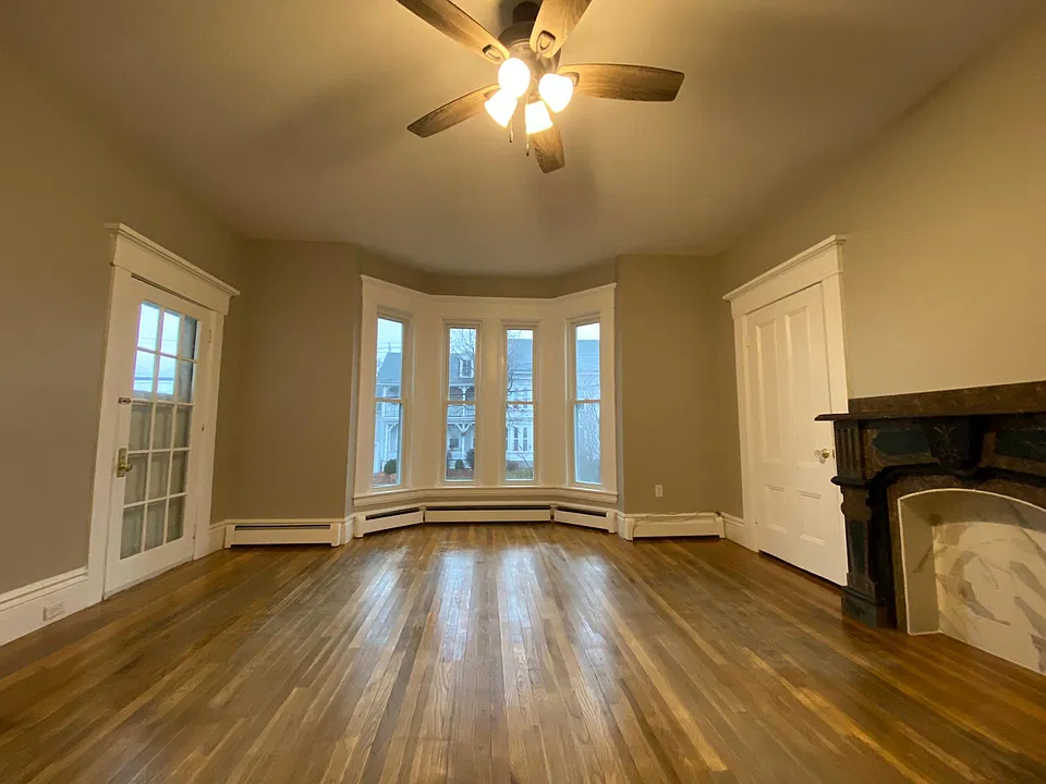 Spacious living room off of kitchen with access to screened-in-porch.