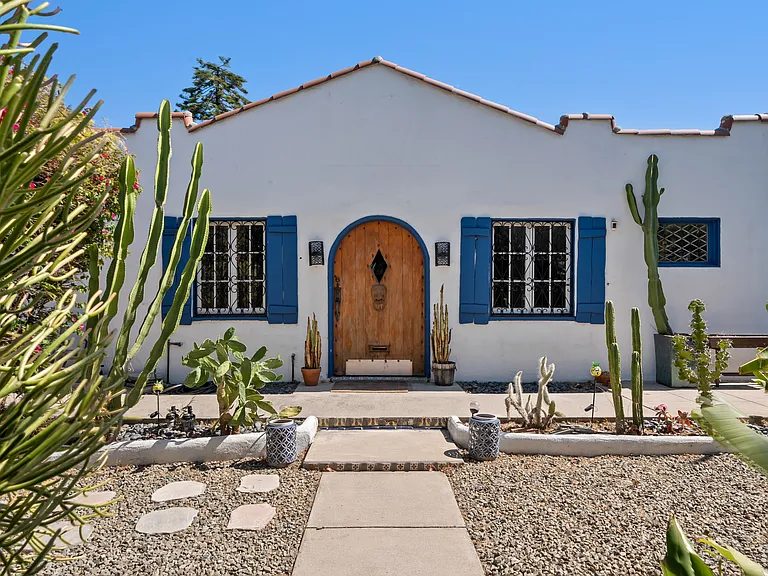Mediterranean style front house and front yard