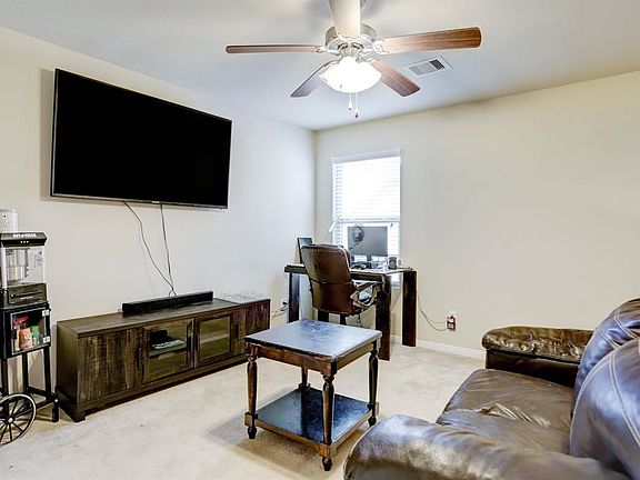 Large game room on the second floor and open to the living area. Use this as a play room, man cave or office!