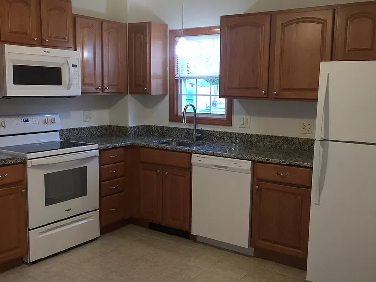 Kitchen - Has tile flooring and granite counter tops. Newer sink, faucet, appliances, and fixtures.